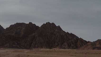 rocky mountains and desert landscape and sunset sky in Egypt