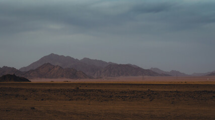 rocky mountains and desert landscape and sunset sky in Egypt