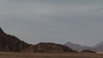 rocky mountains and desert landscape and sunset sky in Egypt