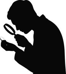 silhouette of person inspecting coin with magnifier