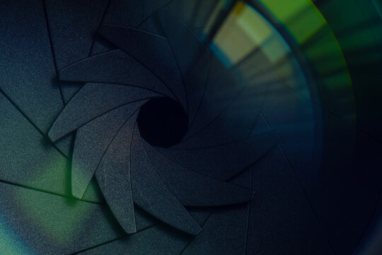 Close-up macro video camera lens,Close up Beautiful camera lens with multi colored light. Background pattern for design. - Powered by Adobe