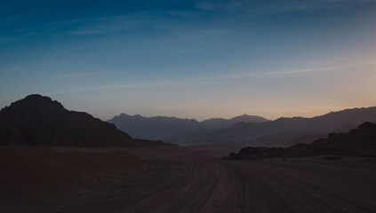 rocky mountains and desert landscape and sunset sky in Egypt