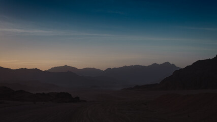 rocky mountains and desert landscape and sunset sky in Egypt