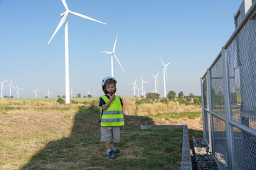 Children are running on a natural energy farm such as windmills and electricity.