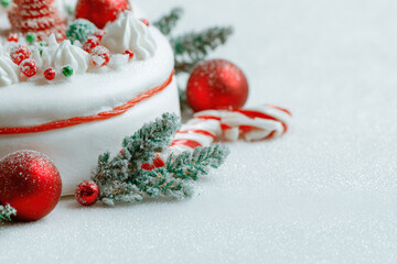 beautifully decorated christmas cake adorned with colorful ornaments and festive decorations
