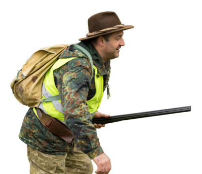 Pheasant hunters with shotgun walking through a meadow.