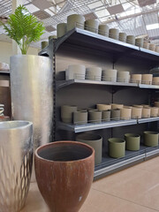 Many ceramic products different sizes in flower shop
