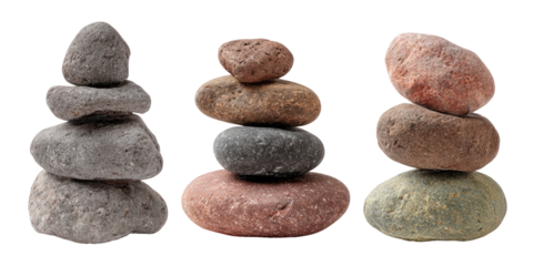 Three stacks of various colored stones, balancing artfully on black backdrop