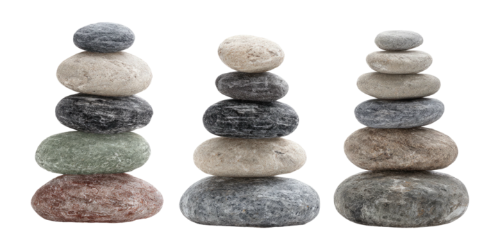 Three stacks of smooth, different-colored rocks balanced on top of each other