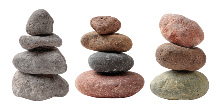 Three stacks of various colored stones, balancing artfully on black backdrop