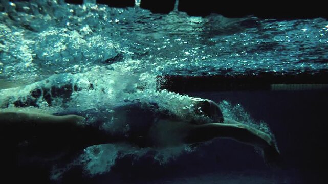 Cinematic Slow Motion of Female Backstroke Start with Underwater Transition