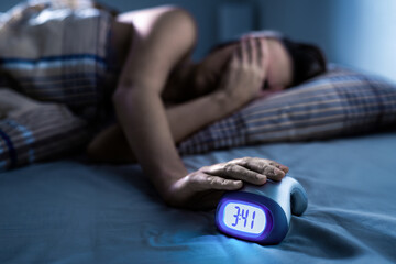 Insomnia and sleep apnea disorder. Woman at night with alarm. Bad anxiety with clock. Nightmare trouble in bed. Depressed sleepless person. Noisy neighbour keeping awake.