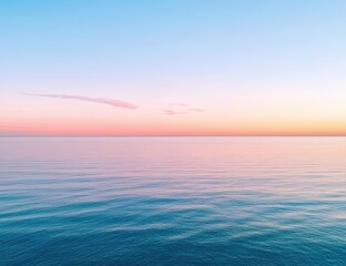 Fototapeta premium A serene ocean view at sunset, showcasing calm waters and a gradient sky filled with soft pastel hues.