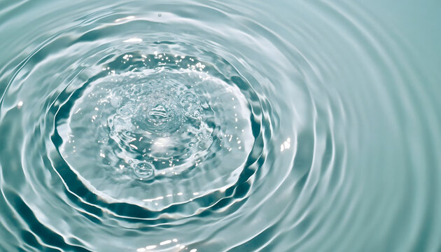 Close-up of serene, clear water surface showing mesmerizing ripples, perfectly formed concentric circles showcasing elegant fluid motion from drop impact, creating calming abstract pattern