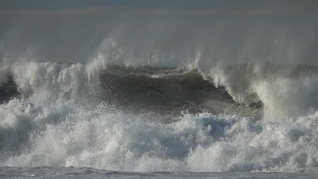 Sea big wave sea spray foam, blue sky
