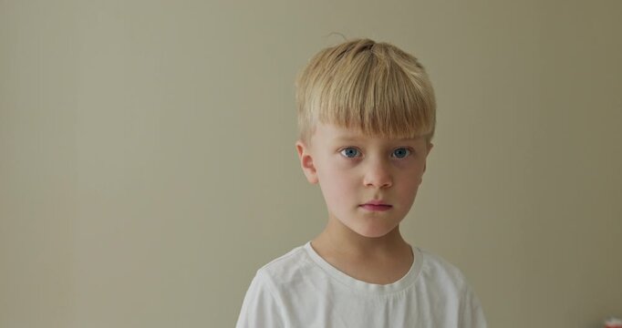 Child shows feelings, Young male exhibiting spectrum of thoughts and feelings, Youthful face conveying various inner sentiments and conceptual expressions