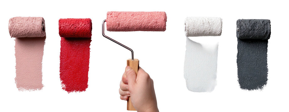 A hand holding a paint roller showcasing various colors in strokes against a black background