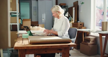 Laptop, laughing and phone call with woman in logistics office for delivery or shipping update. Computer, conversation and funny with mature employee typing in supply chain workplace for distribution - Powered by Adobe