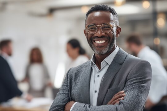 Confident Man Smiling in a Modern Office During a Business Meeting
