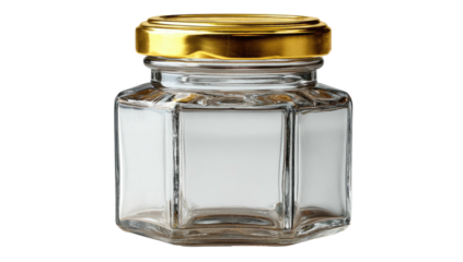 Close-up studio shot of a small, hexagonal glass jar with a shiny gold lid