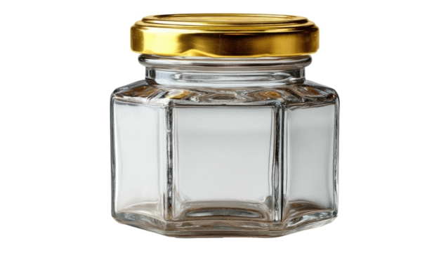 Close-up studio shot of a small, hexagonal glass jar with a shiny gold lid