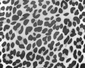 Black and white leopard print fabric pattern in close up