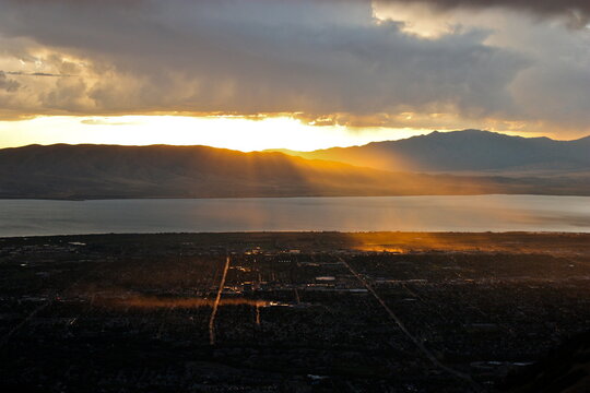 Sunset over a lake and Squaw Peak near Provo, Utah, USA