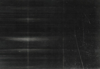 Dark grunge texture background with subtle scratches, dust specks, and linear marks to elevate digital artwork, photography backdrops, posters, branding projects