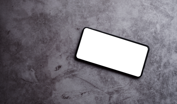 Smartphone laying on desk surface with PNG screen for mockup. Mobile phone template.