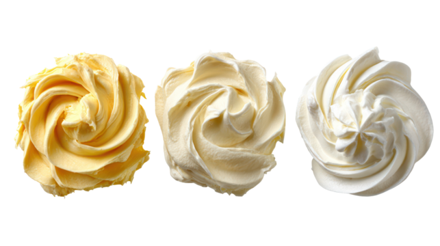 Three swirls of creamy frosting or meringue isolated on transparent background