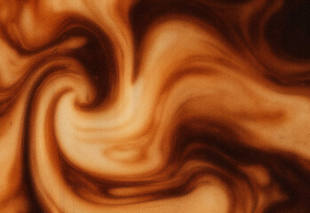 Close-up of a marbled texture in warm brown and cream tones, resembling chocolate and caramel patterns, ideal for elegant backgrounds, design projects, and luxury visuals