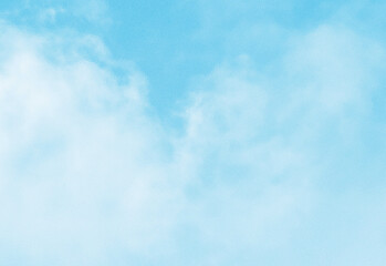 Clear blue sky with soft white wispy clouds overhead, creating a tranquil, airy backdrop suitable for nature, travel, outdoor scenes, background design, and peaceful mood imagery.