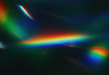 Abstract night photography featuring colorful light refractions and rainbow prisms across a dark surface, creating vibrant luminous bands for artistic visuals and moody atmosphere