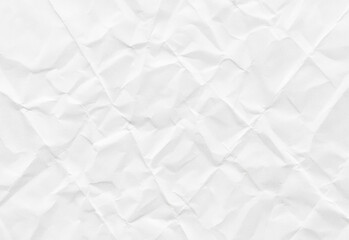 High resolution close up of a white crumpled paper texture showing irregular creases, gentle shadows, and a clean neutral surface, ideal as a versatile background for layouts and mockups.