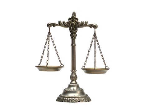 Ornate metallic balance scale on black background