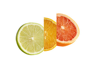 Close-up of three citrus fruit slices.  Lime, orange, and grapefruit segments are displayed.  Bright colors.  Fresh.  Healthy