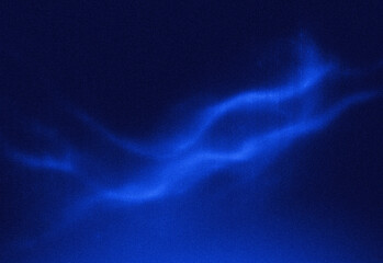 Abstract blue night sky featuring a field of stars and a glowing wispy nebula sweeping across the frame, ideal for technology, science, design, and creative branding visuals