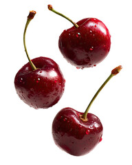 Three ripe cherries, glossy red, with water droplets,  isolated against black