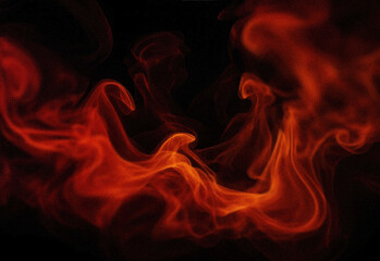 Fototapeta premium Abstract orange smoke swirls against a dark background, dramatic fiery wisps forming organic shapes and flowing ribbons, high-contrast moody texture for dramatic design projects