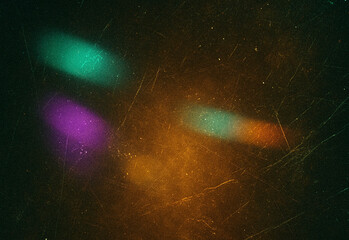 Abstract cosmic light trails and starry background featuring neon green, purple, teal, and orange bokeh streaks across a grainy dark canvas for creative design and visual effects