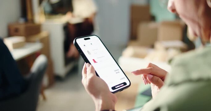 Hands, phone screen and online shopping for fashion, shoes or decision in logistics office. Internet store, mobile app and woman with purchase, clearance sale or ecommerce payment in startup business