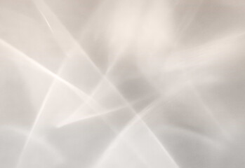 Abstract grayscale light reflections featuring sharp geometric lines and soft gradients across a modern, minimalist background suitable for technology, design, and business visuals