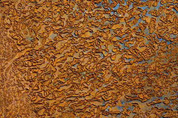 Abstract background with old rusty metal surface, closeup. Orange worn rusty metal texture