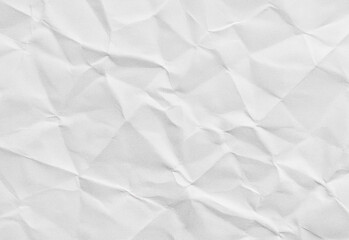 Close up of a crumpled gray paper texture with soft shadows and irregular folds, suitable as a neutral backdrop for design projects, presentations, textures, and photo composites