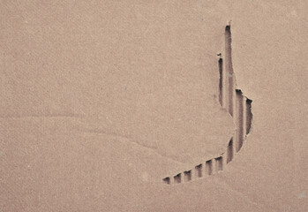 Close up of delicate curved footprints in warm sandy surface forming a quiet path, offering minimal, contemplative imagery for travel, nature, and editorial use