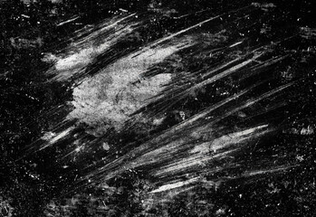 Monochrome abstract texture featuring a distressed scratched surface with rugged white streaks on a deep black background, ideal for grunge design, backgrounds, and edgy layouts