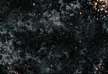 Close up of a dark, granular textured surface with scattered bronze brown specks creating an abstract, moody background suitable for design, photography, and creative projects
