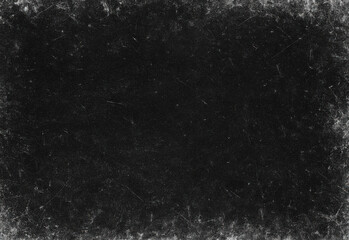 Dark grunge texture background featuring rough, distressed black surface with subtle speckling and irregular edges ideal as a versatile backdrop for design and photography