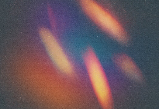 Abstract composition of colorful light trails and bokeh textures on a grainy dark background, featuring luminous orange, pink, purple, and blue streaks for vibrant ambient visuals