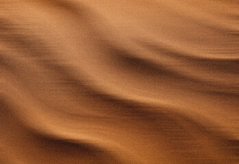 Close up of golden desert sand dunes with wind-carved ripples and warm sunlight creating soft shadows, showcasing textured surface, natural landscape, and travel photography appeal